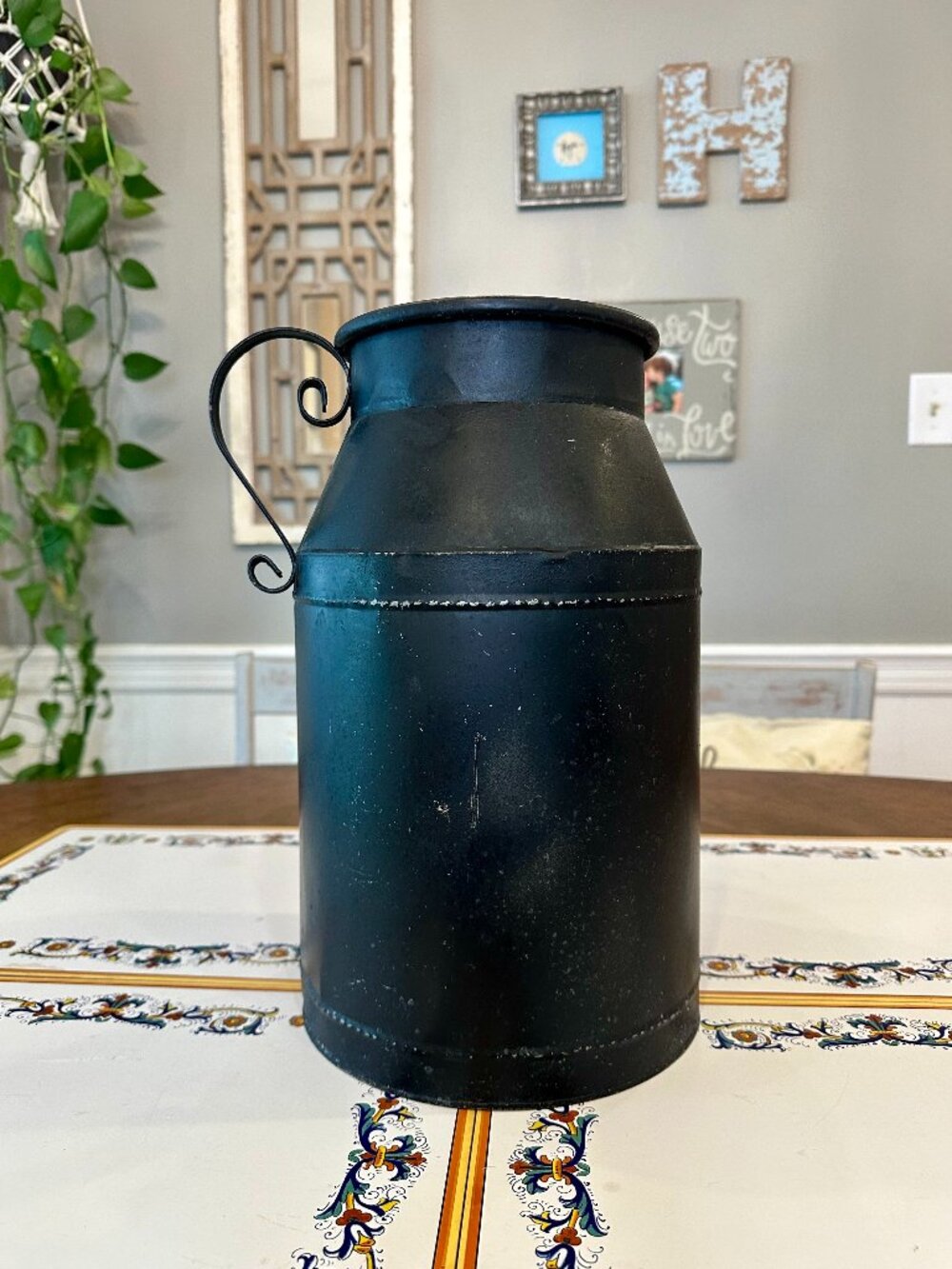 black rustic farmhouse-style metal milk can vase